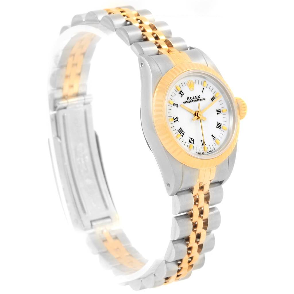 The Rolex Oyster Perpetual 67193 Women's Steel and Gold (two tone) White Dial 67193 Women's Steel and Gold (two tone) White Dial watch is shown in a side angle, highlighting its two-tone band, white dial, and gold bezel.