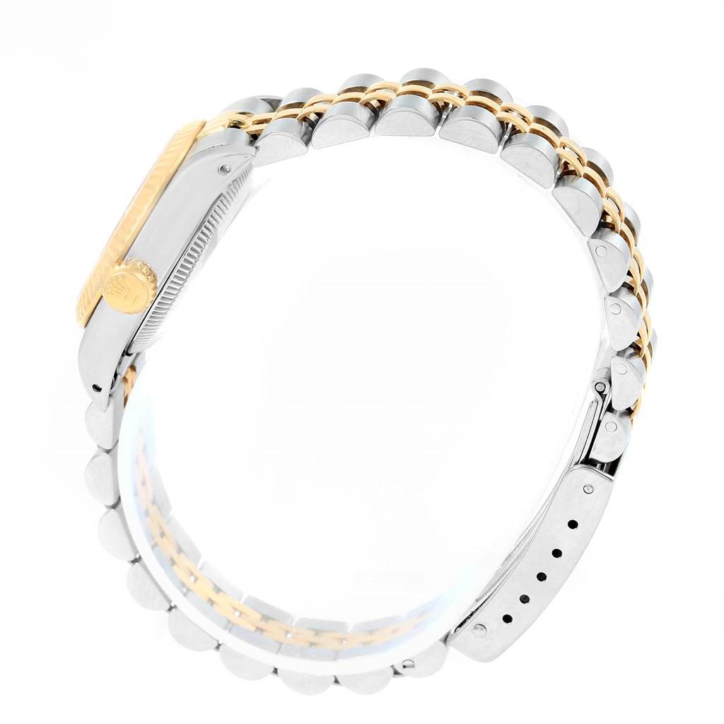 This image shows a side view of the strap and case edge of a Rolex Oyster Perpetual 67193 Women's Steel and Gold (two tone) White Dial 67193 Women's Steel and Gold (two tone) White Dial watch.