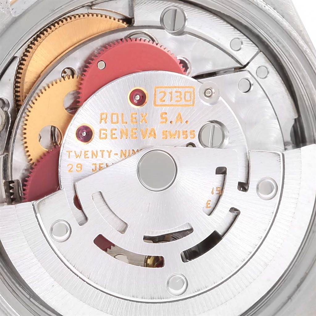 This image shows the inner mechanical movement of a Rolex Oyster Perpetual 67193 Women's Steel and Gold (two tone) White Dial 67193 Women's Steel and Gold (two tone) White Dial watch, specifically the automatic winding rotor and gear mechanisms.