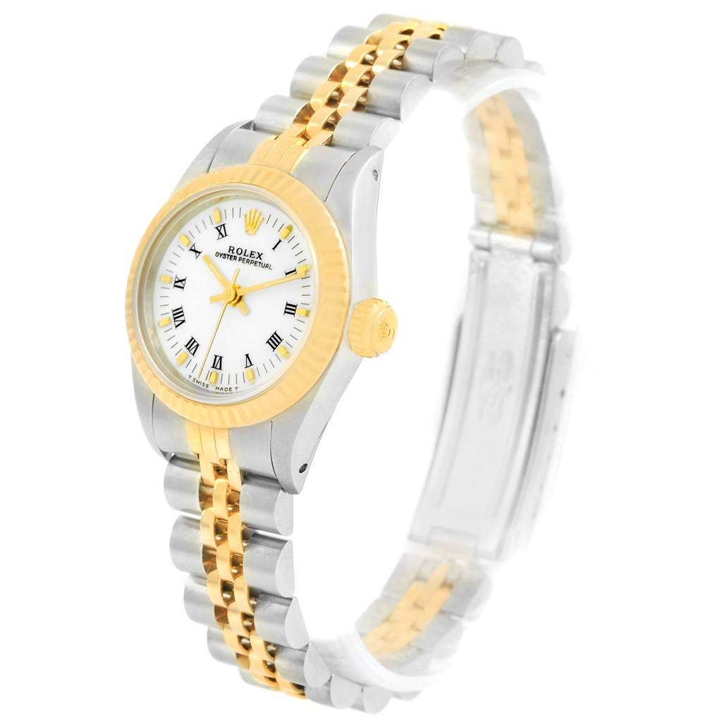The image shows a Rolex Oyster Perpetual 67193 Women's Steel and Gold (two tone) White Dial 67193 Women's Steel and Gold (two tone) White Dial watch at a side angle, displaying its white dial, gold bezel, crown, and bi-tone bracelet.