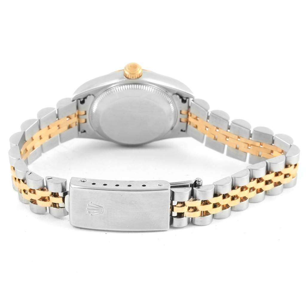 This image shows the back of a Rolex Oyster Perpetual 76193 Women's Steel and Gold (two tone) Black Dial 76193 Women's Steel and Gold (two tone) Black Dial watch, emphasizing the case, crown, and two-tone bracelet with the clasp.