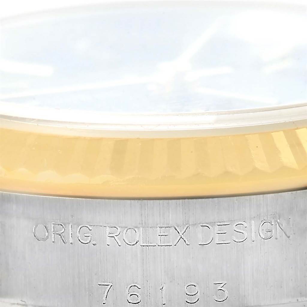 This image shows a close-up of the side of the casing and bezel of a Rolex Oyster Perpetual 76193 Women's Steel and Gold (two tone) Black Dial 76193 Women's Steel and Gold (two tone) Black Dial watch, displaying the model number "76193".