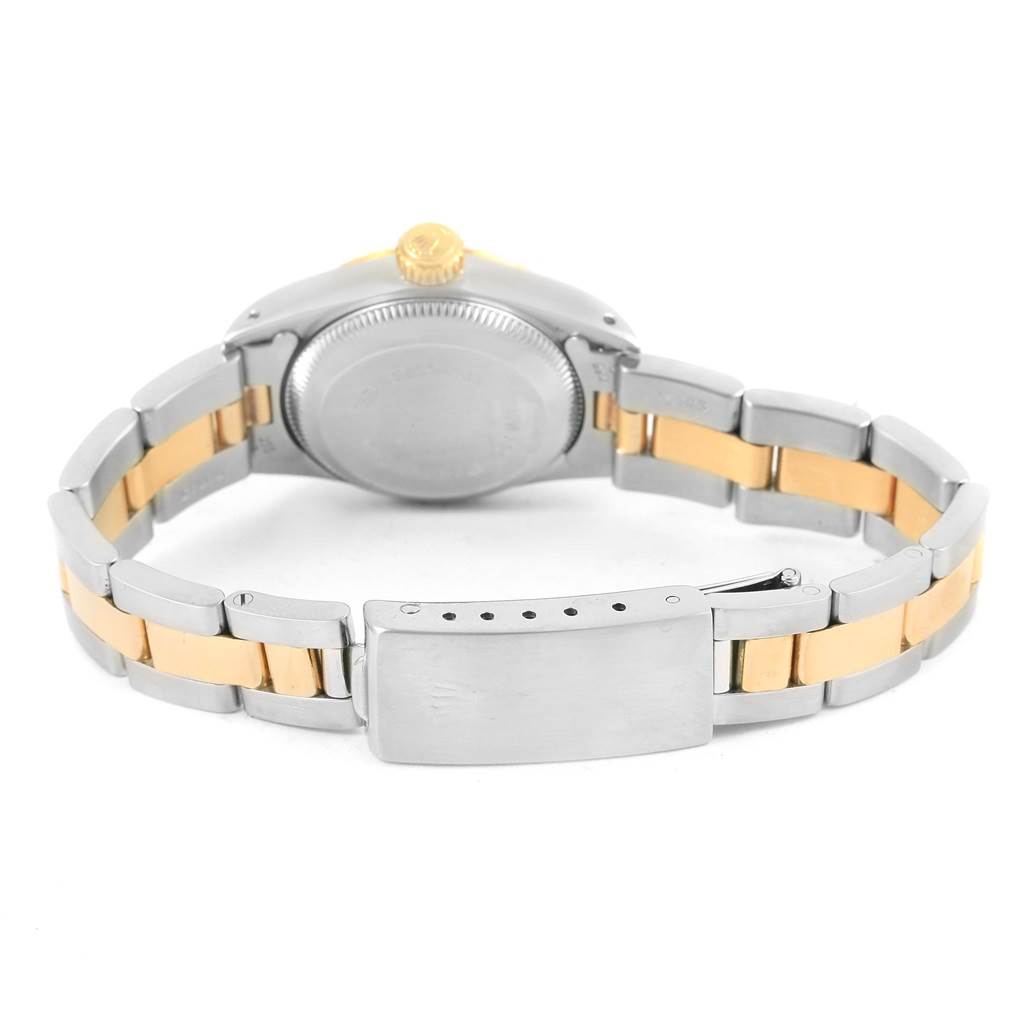 The image shows the back of a Rolex Oyster Perpetual 67193 Women
s Steel and Gold (two tone) Champagne Dial 67193 Women
s Steel and Gold (two tone) Champagne Dial watch, displaying the case back, crown, and the metal bracelet with clasp.