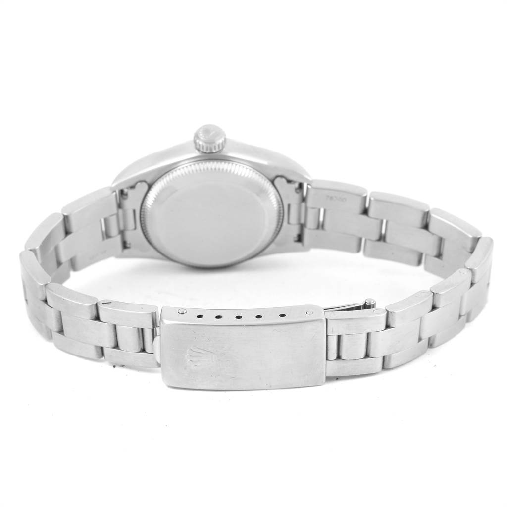 This image shows the back and bracelet of a Rolex Oyster Perpetual 67180 Women's Stainless Steel Black Dial 67180 Women's Stainless Steel Black Dial watch, featuring its clasp and caseback.