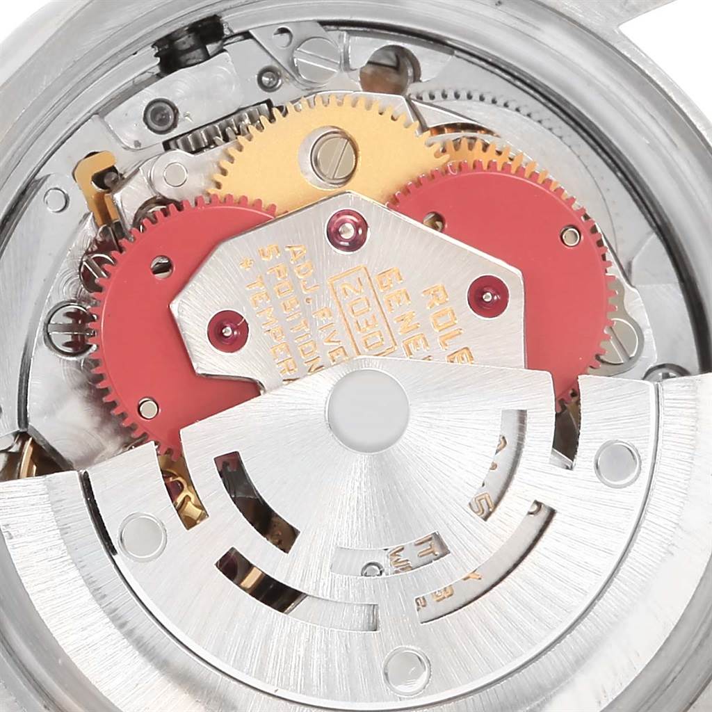 This image shows the internal mechanism of a Rolex Oyster Perpetual 6719 Women's Steel and Gold (two tone) Champagne Dial 6719 Women's Steel and Gold (two tone) Champagne Dial watch, showcasing gears and components from a macro angle.