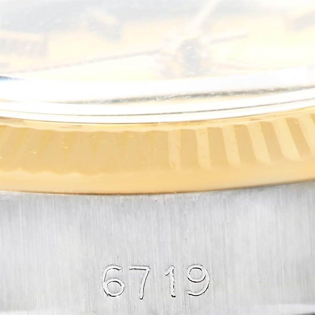 The image shows a close-up of the case side and bezel of a Rolex Oyster Perpetual 6719 Women's Steel and Gold (two tone) Champagne Dial 6719 Women's Steel and Gold (two tone) Champagne Dial watch, model number 6719.