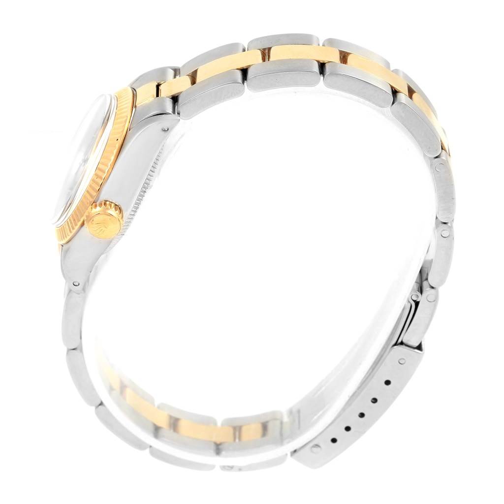 The image shows a side view of the Rolex Oyster Perpetual 6719 Women's Steel and Gold (two tone) Champagne Dial 6719 Women's Steel and Gold (two tone) Champagne Dial model, highlighting the crown, case, and two-tone bracelet.