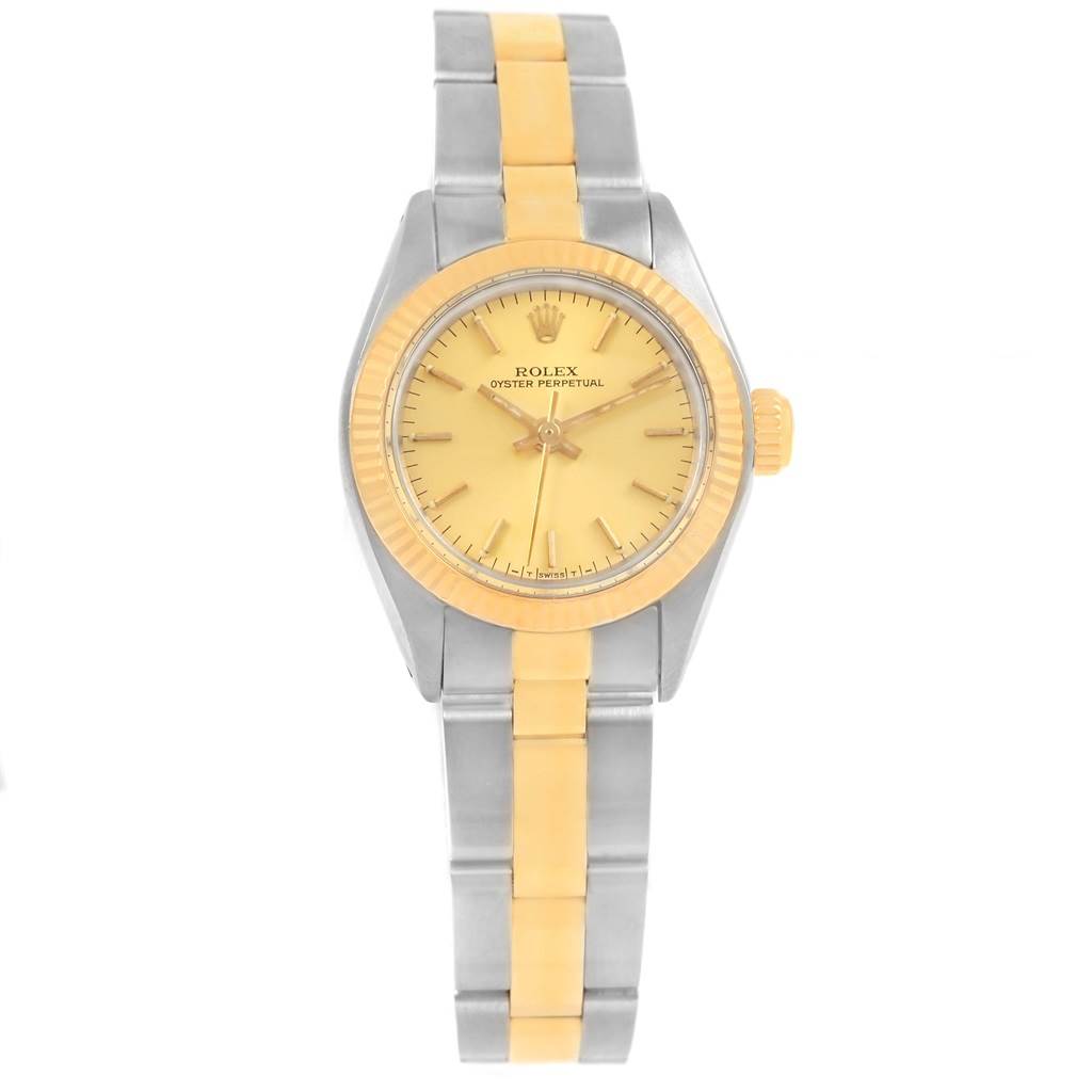 The image shows a front view of a Rolex Oyster Perpetual 6719 Women's Steel and Gold (two tone) Champagne Dial 6719 Women's Steel and Gold (two tone) Champagne Dial watch with a gold dial, bezel, and a two-tone metal bracelet.