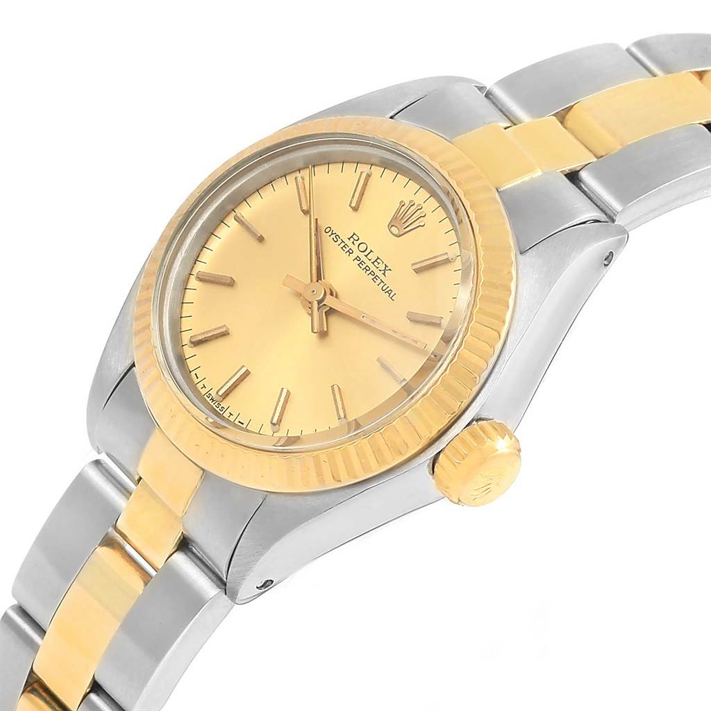 The image shows a side angle of a Rolex Oyster Perpetual 6719 Women's Steel and Gold (two tone) Champagne Dial 6719 Women's Steel and Gold (two tone) Champagne Dial watch focusing on the face, bezel, and bracelet.