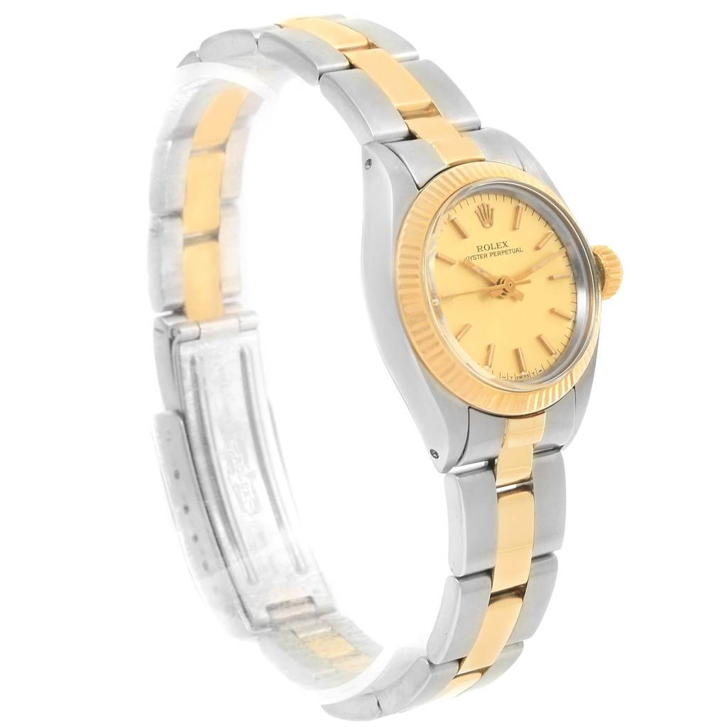 The image shows a side view of a Rolex Oyster Perpetual 6719 Women's Steel and Gold (two tone) Champagne Dial 6719 Women's Steel and Gold (two tone) Champagne Dial watch featuring a two-tone metal bracelet and a gold dial.