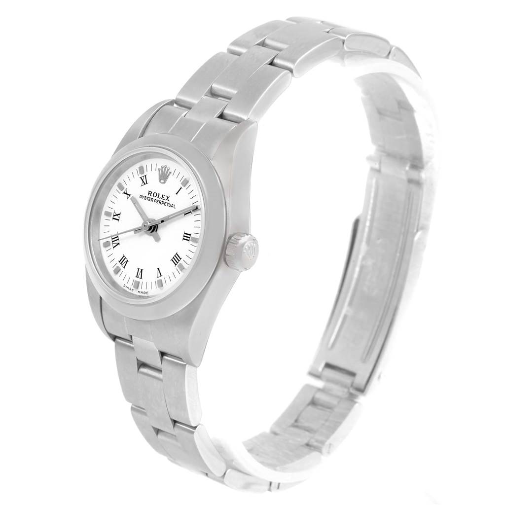The Rolex Oyster Perpetual 76080 Women
s Stainless Steel White Dial 76080 Women
s Stainless Steel White Dial watch is shown from an angled side view, highlighting the face, bezel, and bracelet.