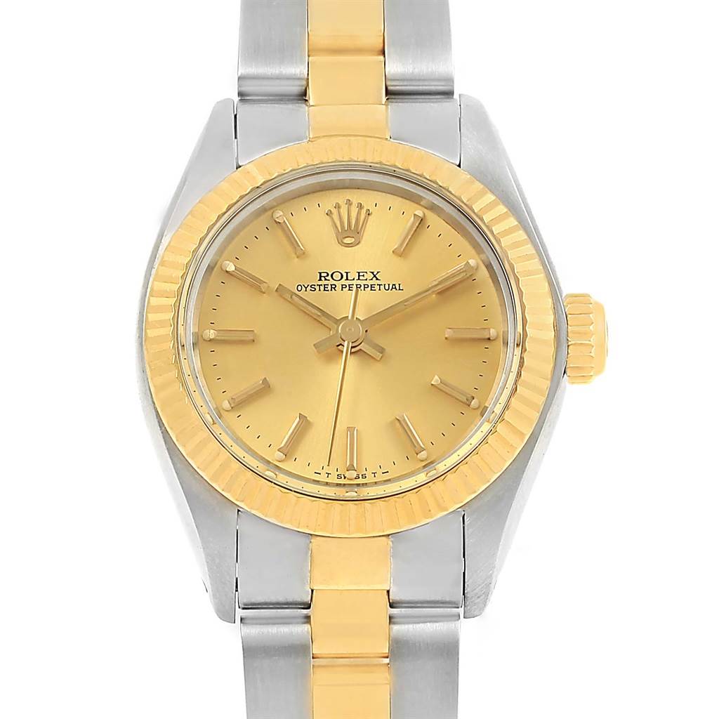The image shows a front view of the Rolex Oyster Perpetual 6719 Women's Steel and Gold (two tone) Champagne Dial 6719 Women's Steel and Gold (two tone) Champagne Dial watch, including the dial, bezel, and portion of the bracelet.