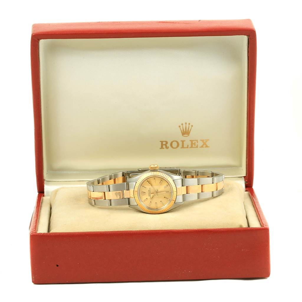 The image shows a Rolex Oyster Perpetual 6719 Women's Steel and Gold (two tone) Champagne Dial 6719 Women's Steel and Gold (two tone) Champagne Dial watch inside its open red presentation box, viewed from the front.