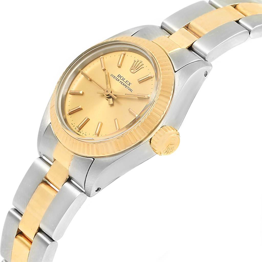 The image shows a Rolex Oyster Perpetual 6719 Women's Steel and Gold (two tone) Champagne Dial 6719 Women's Steel and Gold (two tone) Champagne Dial watch from an angled side view, highlighting its gold dial, bezel, and two-tone bracelet.