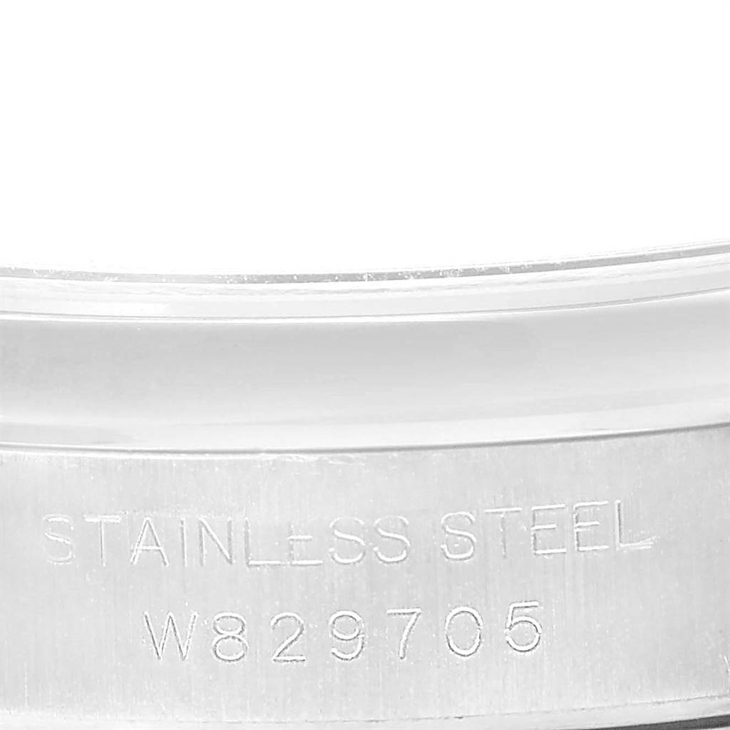 This image shows a close-up of the stainless steel casing with the serial number of the Rolex Oyster Perpetual 67180 Women
s Stainless Steel Blue Dial 67180 Women
s Stainless Steel Blue Dial watch.