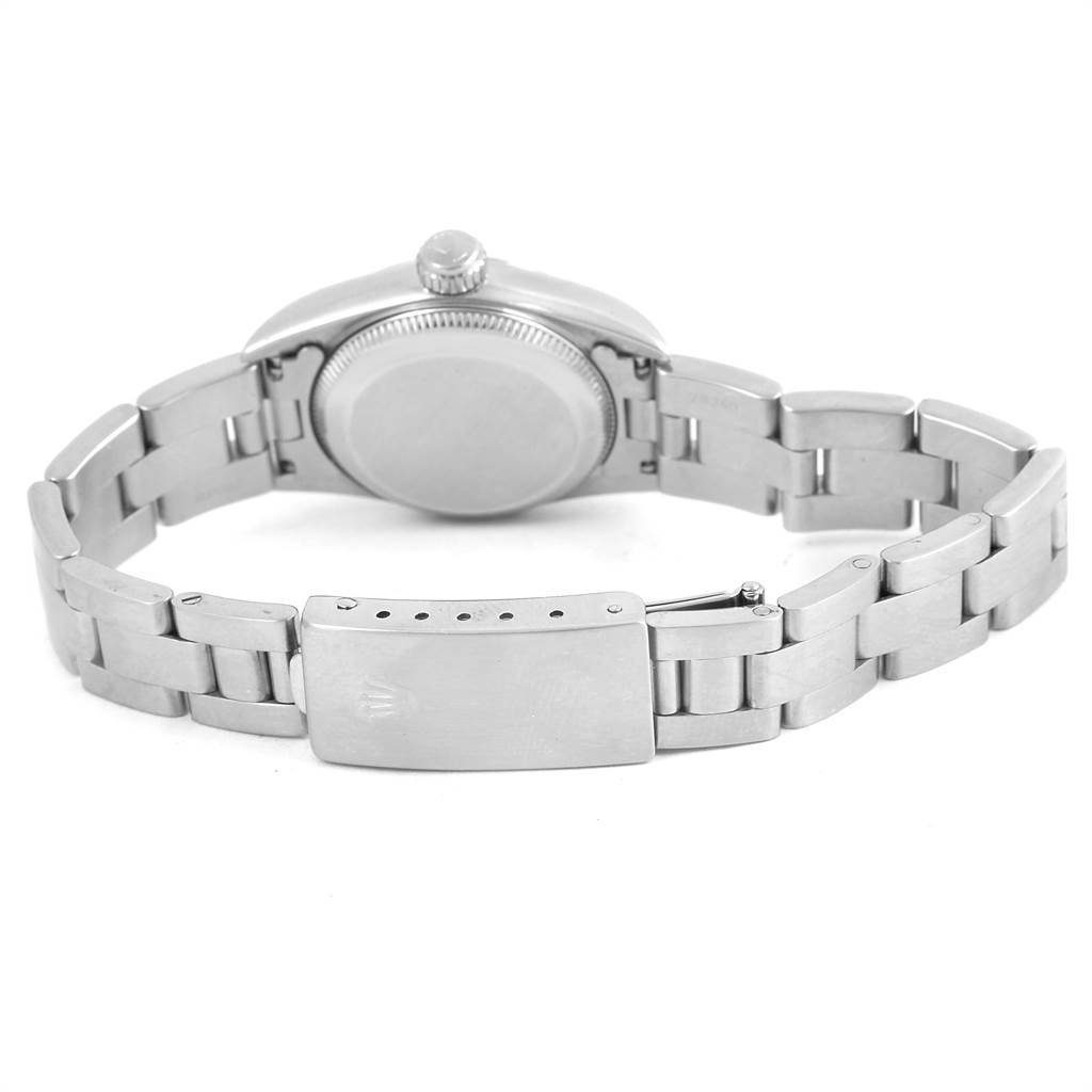 The image shows the back view of a Rolex Oyster Perpetual 67180 Women
s Stainless Steel Blue Dial 67180 Women
s Stainless Steel Blue Dial watch, highlighting its case back, crown, and bracelet with clasp.