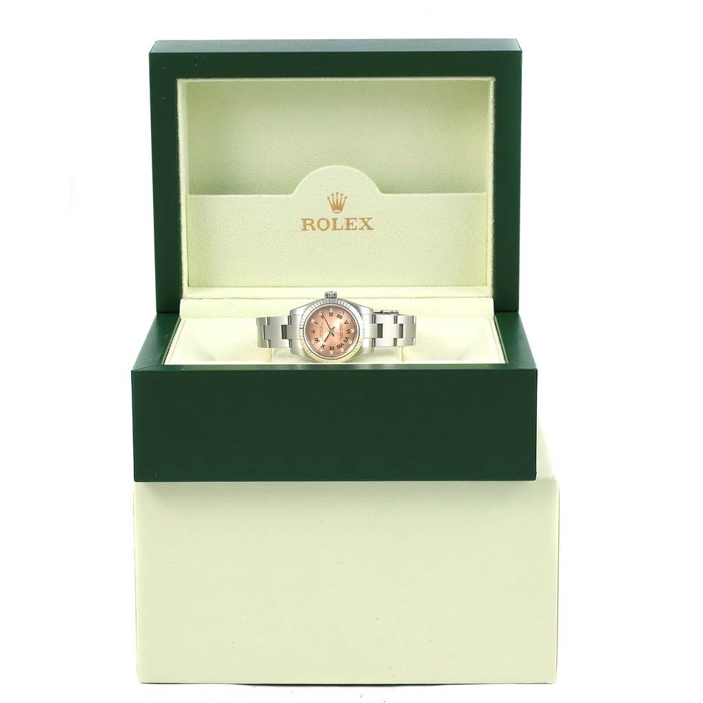 The Rolex Oyster Perpetual 176234 Women
s Stainless Steel Pink Dial 176234 Women
s Stainless Steel Pink Dial watch is displayed front-facing inside an open green box with the brand logo visible above.