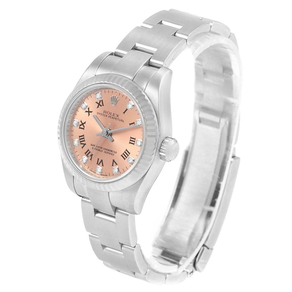 The image shows a Rolex Oyster Perpetual 176234 Women
s Stainless Steel Pink Dial 176234 Women
s Stainless Steel Pink Dial watch at an angle, highlighting its pink dial, Roman numerals, and stainless steel bracelet.