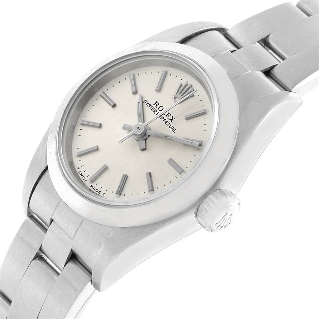 The image shows a top-angle view of a Rolex Oyster Perpetual 67180 Women
s Stainless Steel Silver Dial 67180 Women
s Stainless Steel Silver Dial watch, highlighting the face, hands, case, and part of the bracelet.