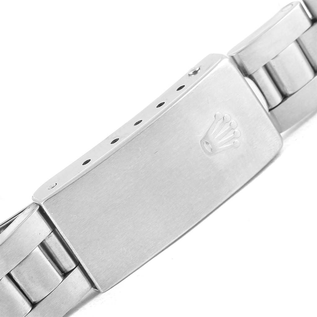 This image shows the clasp buckle of a Rolex Oyster Perpetual 76094 Women
s Stainless Steel Pink Dial 76094 Women
s Stainless Steel Pink Dial watch bracelet at a close-up angle.
