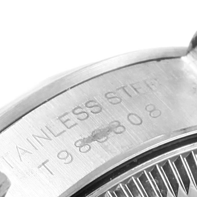 This image shows a close-up view of the back casing and engravings on a Rolex Oyster Perpetual 67180 Women
s Stainless Steel Silver Dial 67180 Women
s Stainless Steel Silver Dial watch.