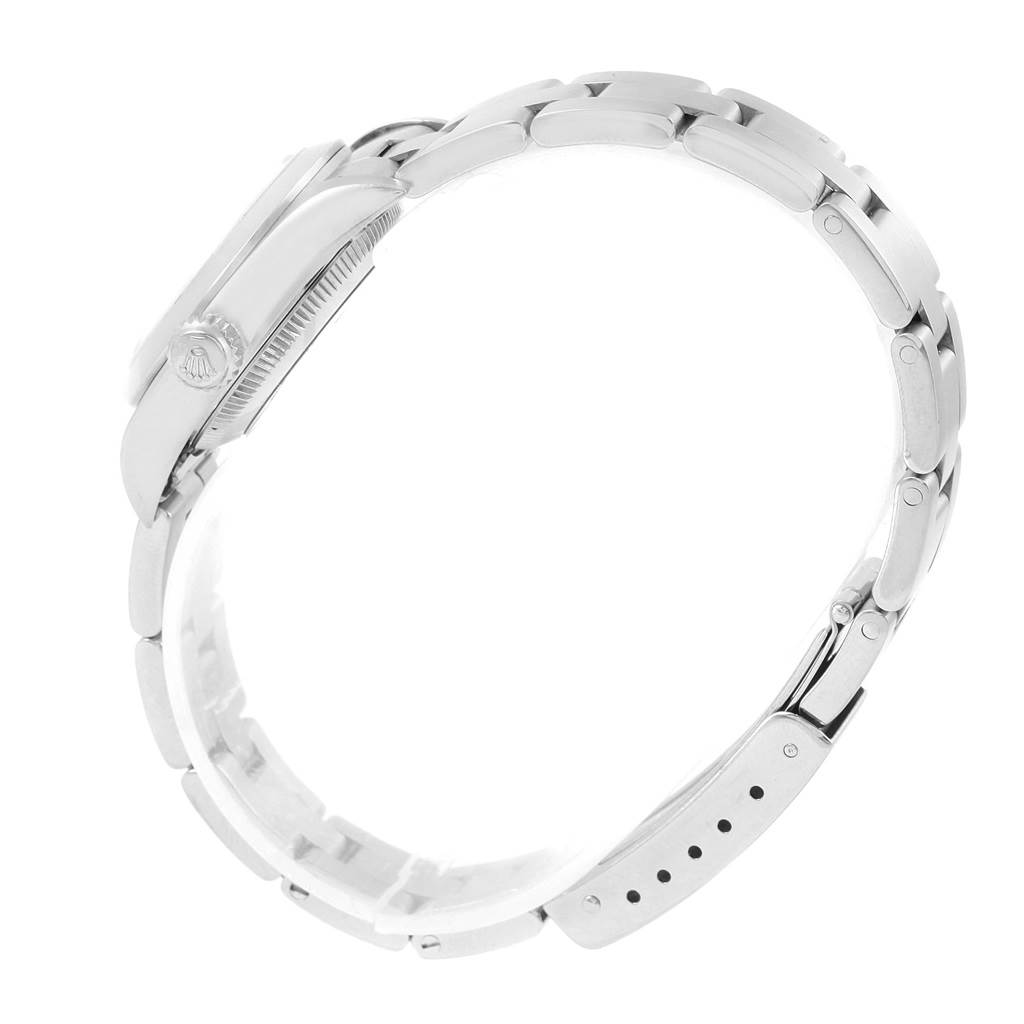 This image shows a side view of a Rolex Oyster Perpetual 67180 Women
s Stainless Steel Silver Dial 67180 Women
s Stainless Steel Silver Dial watch, highlighting the clasp and bracelet links.
