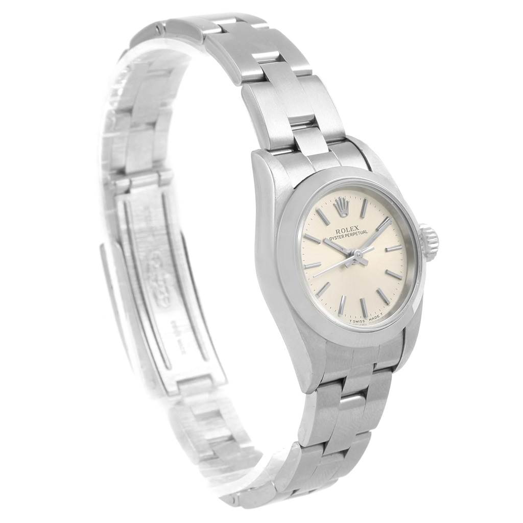 The image shows a side angle of a Rolex Oyster Perpetual 67180 Women
s Stainless Steel Silver Dial 67180 Women
s Stainless Steel Silver Dial watch, highlighting its silver bracelet and dial.