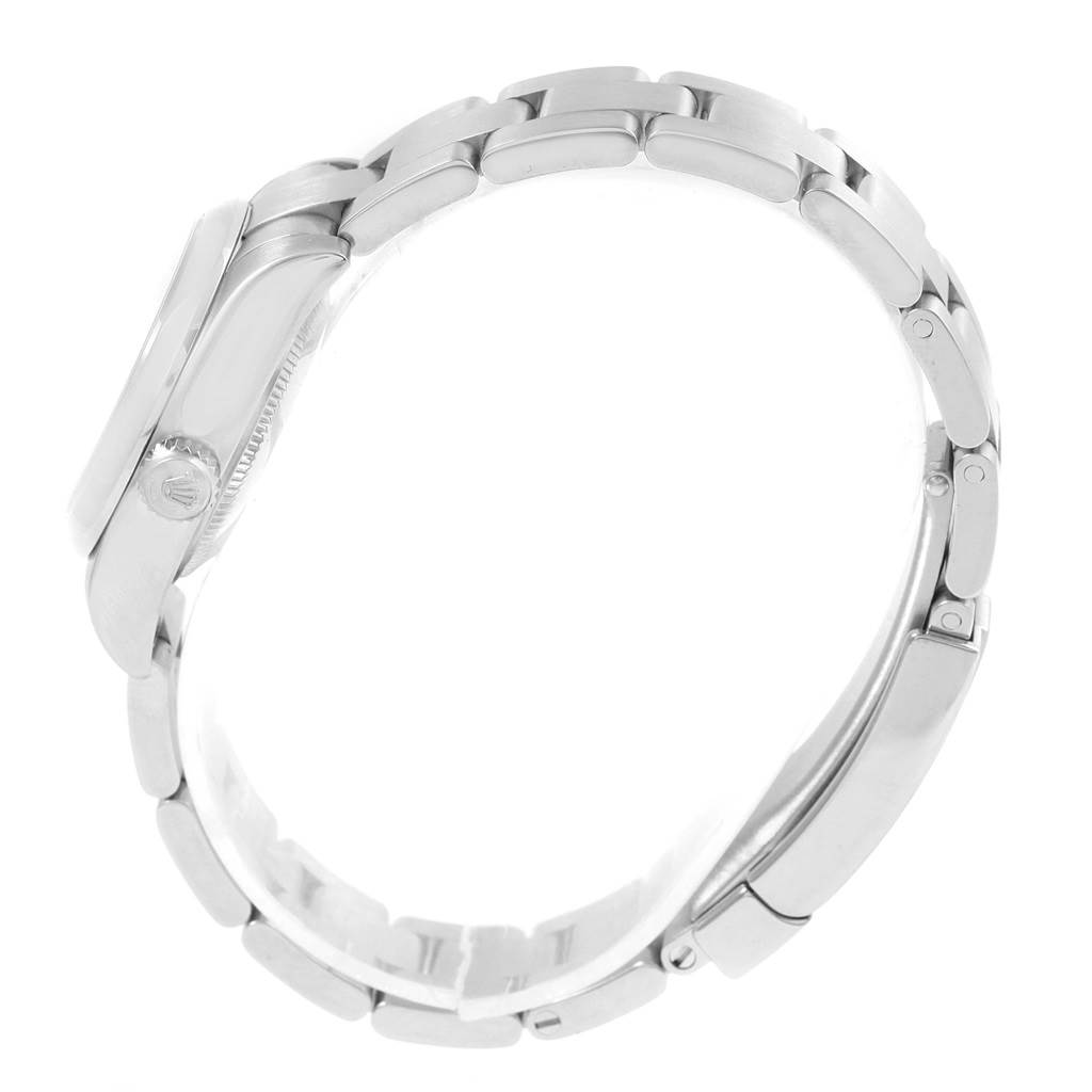 The image shows a side profile of a Rolex Oyster Perpetual 176200 Women
s Stainless Steel Silver Dial 176200 Women
s Stainless Steel Silver Dial watch, focusing on the bracelet and crown.