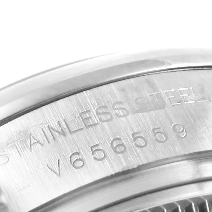 This image shows a close-up of the side engraving and part of the bezel of a Rolex Oyster Perpetual 176200 Women
s Stainless Steel Silver Dial 176200 Women
s Stainless Steel Silver Dial watch.