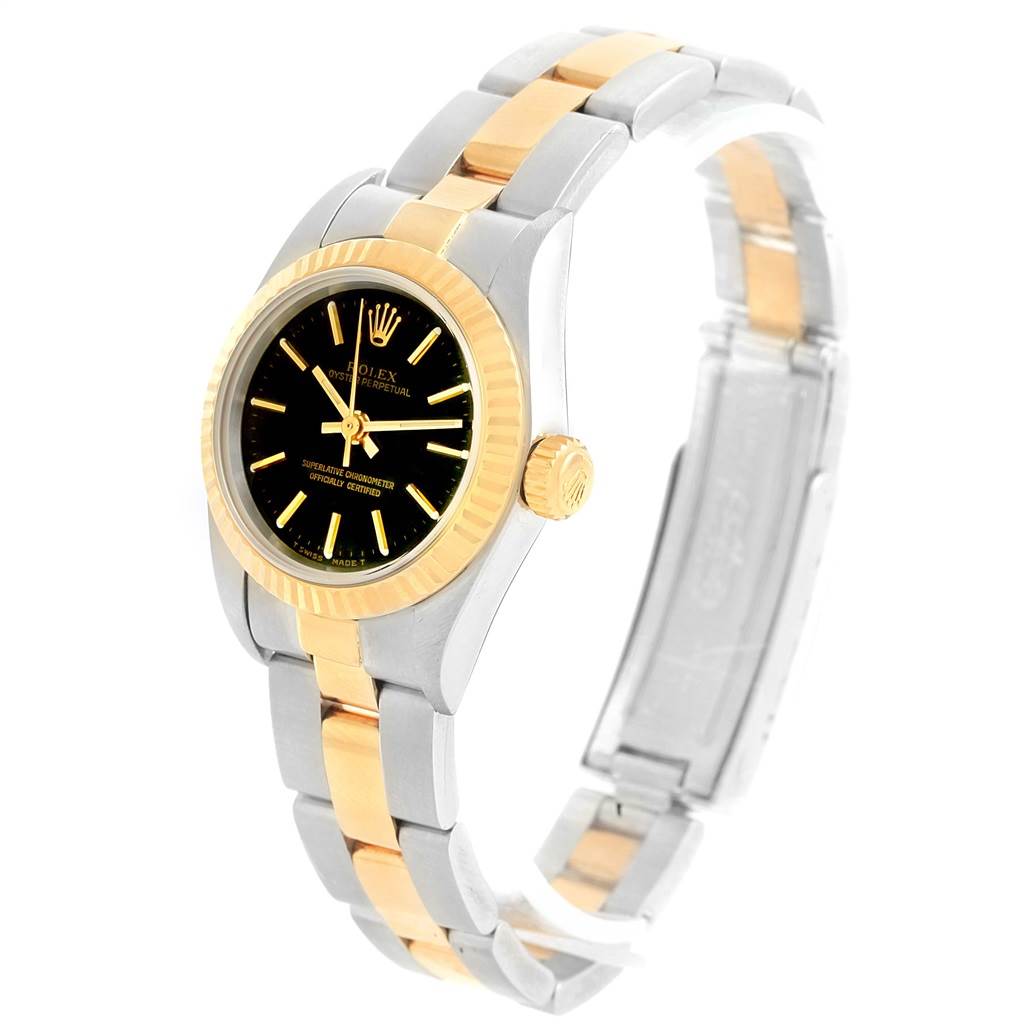 The Rolex Oyster Perpetual 67193 Women's Steel and Gold (two tone) Black Dial 67193 Women's Steel and Gold (two tone) Black Dial watch is shown at an angle displaying the face, bezel, crown, and part of the bracelet.