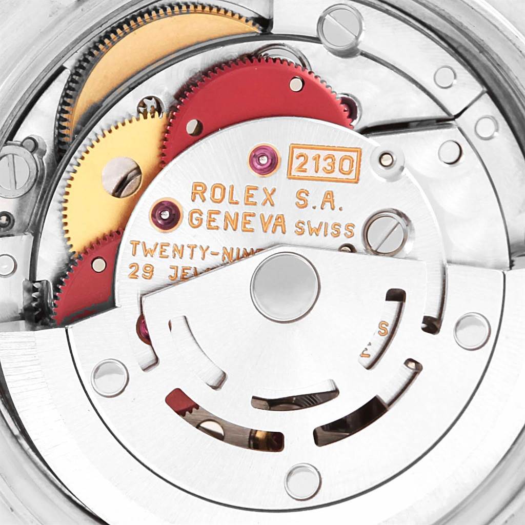 This image shows a close-up view of the movement mechanism inside the Rolex Oyster Perpetual 67193 Women's Steel and Gold (two tone) Black Dial 67193 Women's Steel and Gold (two tone) Black Dial watch.