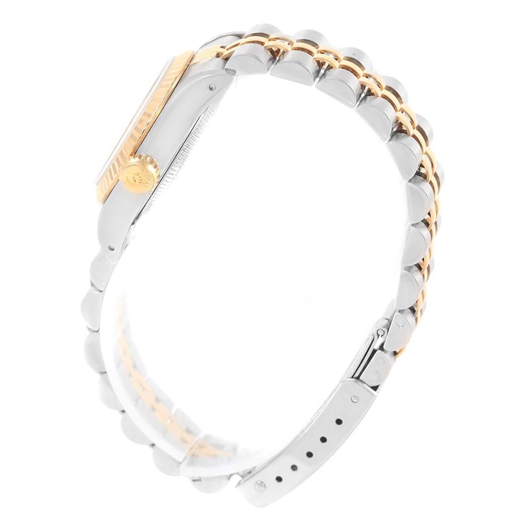 The image shows a side view of the Rolex Oyster Perpetual 67193 Women
s Steel and Gold (two tone) Silver Dial 67193 Women
s Steel and Gold (two tone) Silver Dial watch, highlighting the case, crown, and bi-tone bracelet.