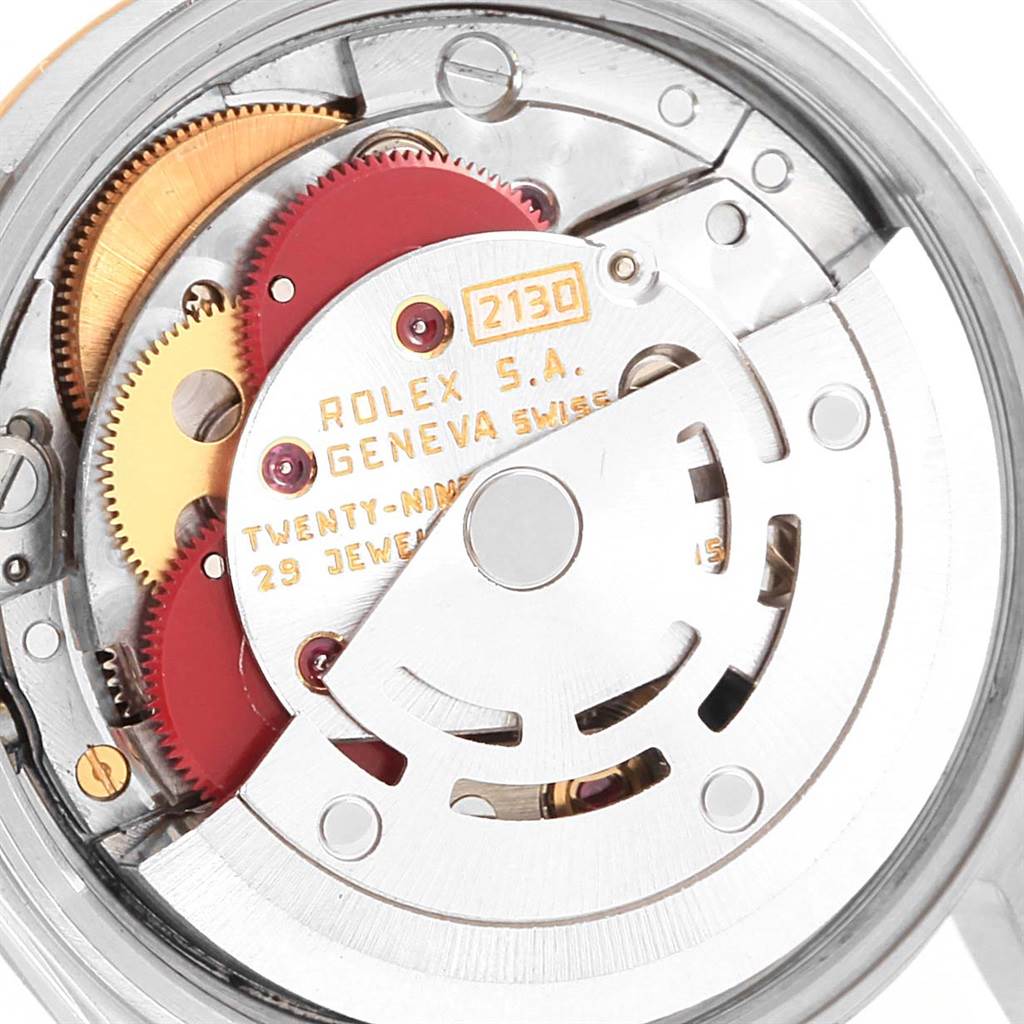 This image shows a close-up of the movement mechanism of a Rolex Oyster Perpetual 67193 Women
s Steel and Gold (two tone) Silver Dial 67193 Women
s Steel and Gold (two tone) Silver Dial watch.