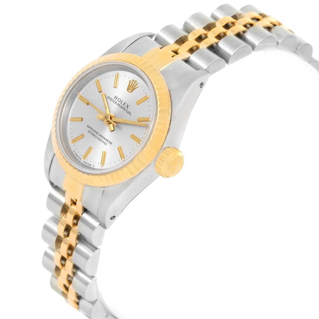 The image shows a Rolex Oyster Perpetual 67193 Women
s Steel and Gold (two tone) Silver Dial 67193 Women
s Steel and Gold (two tone) Silver Dial watch at a slight angle, featuring the dial, crown, and bracelet.