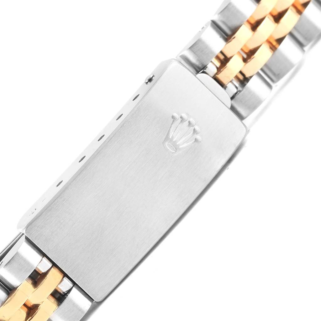 This image shows the clasp of the Rolex Oyster Perpetual 67193 Women
s Steel and Gold (two tone) Silver Dial 67193 Women
s Steel and Gold (two tone) Silver Dial watch bracelet from a top-down angle.