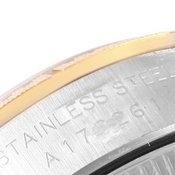 The image shows a close-up angle of the stainless steel case back and bezel of a Rolex Oyster Perpetual 76243 Women's Steel and Gold (two tone) Champagne Dial 76243 Women's Steel and Gold (two tone) Champagne Dial watch.