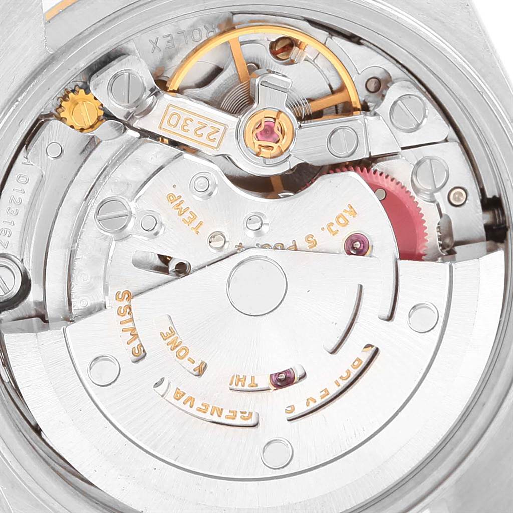 This image shows a close-up view of the inner movement and mechanics of a Rolex Oyster Perpetual 76243 Women's Steel and Gold (two tone) Champagne Dial 76243 Women's Steel and Gold (two tone) Champagne Dial watch.