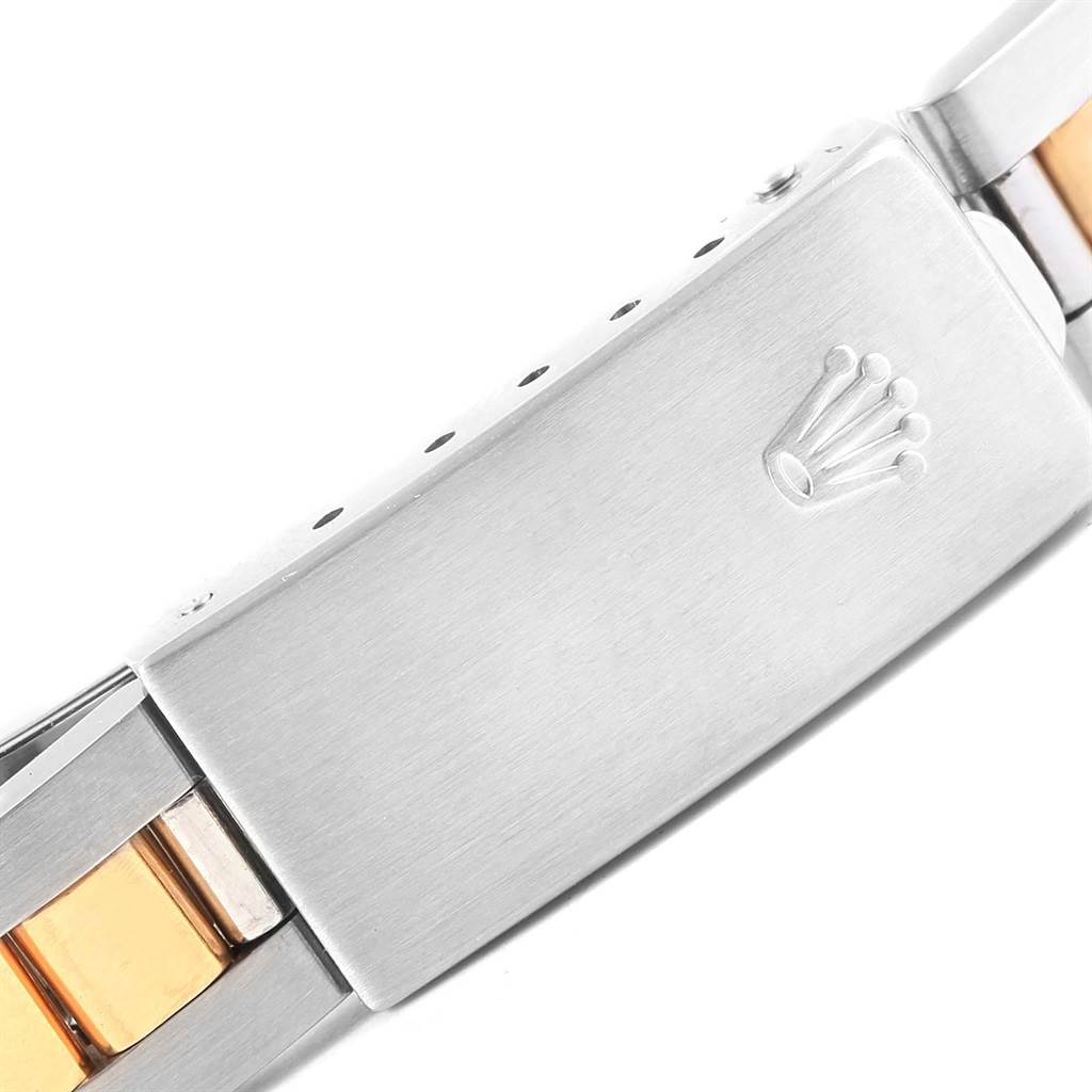 This image shows a close-up of the clasp on a Rolex Oyster Perpetual 76243 Women's Steel and Gold (two tone) Champagne Dial 76243 Women's Steel and Gold (two tone) Champagne Dial watch bracelet.