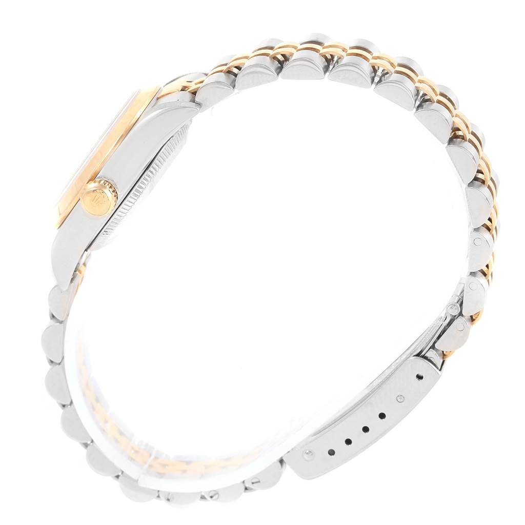 This image shows a side view of the Rolex Oyster Perpetual 76183 Women's Steel and Gold (two tone) Black Dial 76183 Women's Steel and Gold (two tone) Black Dial watch, highlighting the crown and two-tone bracelet.