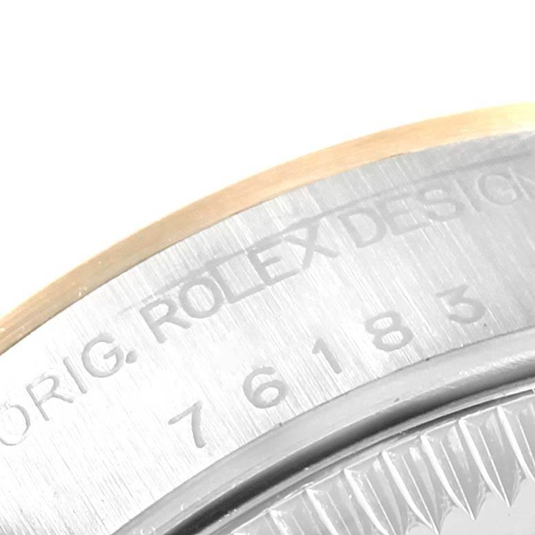 The image shows an angled close-up of the case back and serial number engraving on a Rolex Oyster Perpetual 76183 Women's Steel and Gold (two tone) Black Dial 76183 Women's Steel and Gold (two tone) Black Dial watch.