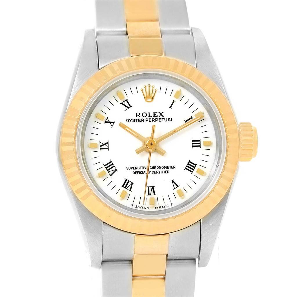 This Rolex Oyster Perpetual 67193 Women
s Steel and Gold (two tone) White Dial 67193 Women
s Steel and Gold (two tone) White Dial watch is shown from the front, highlighting its face, bezel, and partial bracelet.