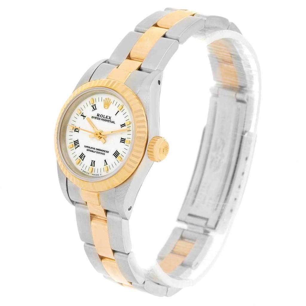 This image shows the Rolex Oyster Perpetual 67193 Women
s Steel and Gold (two tone) White Dial 67193 Women
s Steel and Gold (two tone) White Dial watch at an angled side view, highlighting the bezel, crown, and two-tone bracelet.