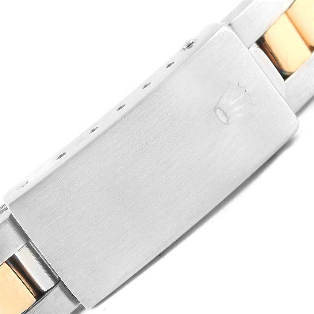 The image shows a close-up of the clasp and part of the bracelet of a Rolex Oyster Perpetual 67193 Women
s Steel and Gold (two tone) White Dial 67193 Women
s Steel and Gold (two tone) White Dial watch.