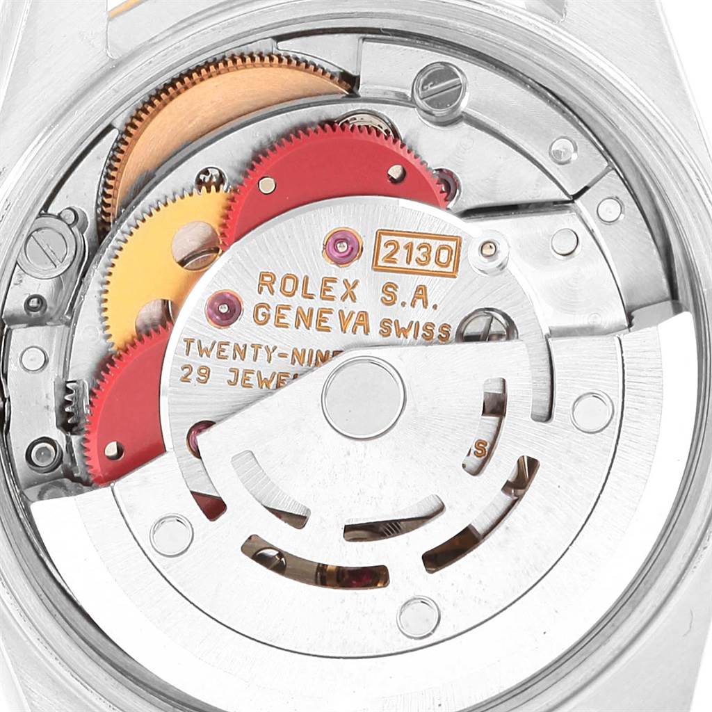 The image shows the intricate movement and components of the Rolex Oyster Perpetual 67193 Women
s Steel and Gold (two tone) White Dial 67193 Women
s Steel and Gold (two tone) White Dial watch, viewed from the back.