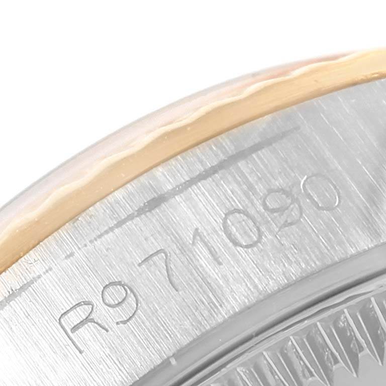 The image shows a close-up angle of the Rolex Oyster Perpetual 67193 Women
s Steel and Gold (two tone) White Dial 67193 Women
s Steel and Gold (two tone) White Dial model, focusing on the edge of the bezel and part of the case.