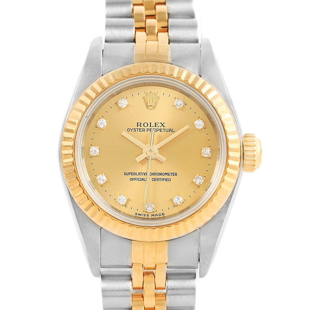 The Rolex Oyster Perpetual 67193 Women's Steel and Gold (two tone) Champagne Dial 67193 Women's Steel and Gold (two tone) Champagne Dial watch is shown from a front angle, displaying its face with a gold dial and diamond hour markers, along with a two-tone bracelet.