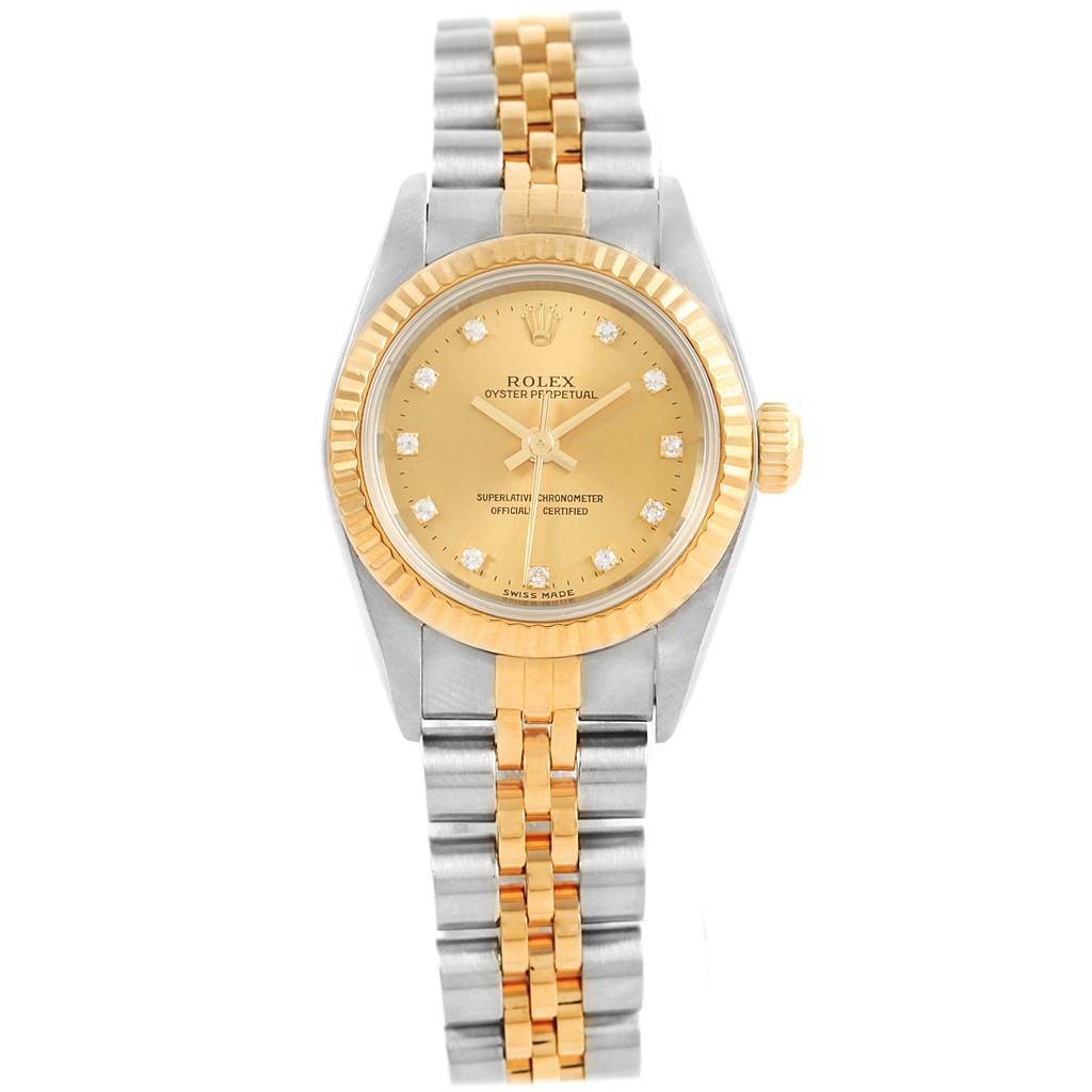This image shows a Rolex Oyster Perpetual 67193 Women's Steel and Gold (two tone) Champagne Dial 67193 Women's Steel and Gold (two tone) Champagne Dial watch from a front angle, highlighting its two-tone bracelet, dial, and bezel.