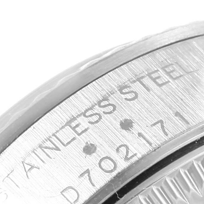 The close-up image shows the side of the casing with "STAINLESS STEEL" engraved on the Rolex Oyster Perpetual 76094 Women's Stainless Steel Black Dial 76094 Women's Stainless Steel Black Dial watch.