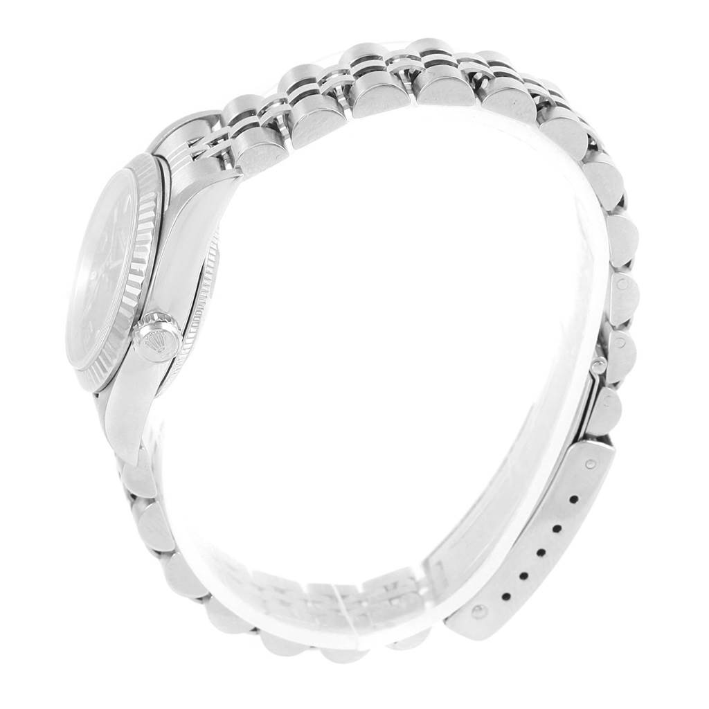 The image shows a side view of the Rolex Oyster Perpetual 76094 Women's Stainless Steel Black Dial 76094 Women's Stainless Steel Black Dial watch focusing on the crown, case, and bracelet.