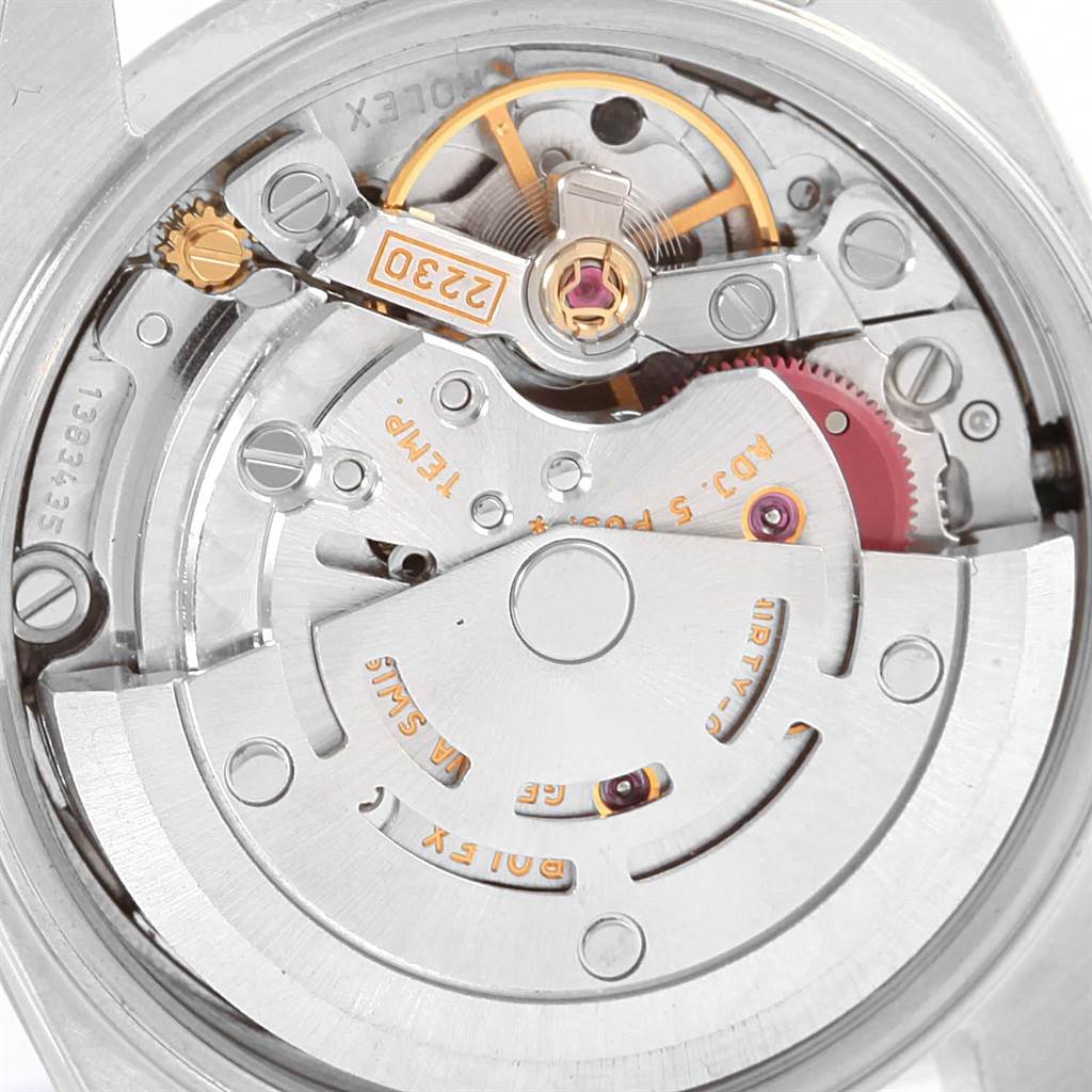 This image shows a close-up of the inner mechanical movement of a Rolex Oyster Perpetual 76094 Women's Stainless Steel Black Dial 76094 Women's Stainless Steel Black Dial watch, highlighting its intricate components.